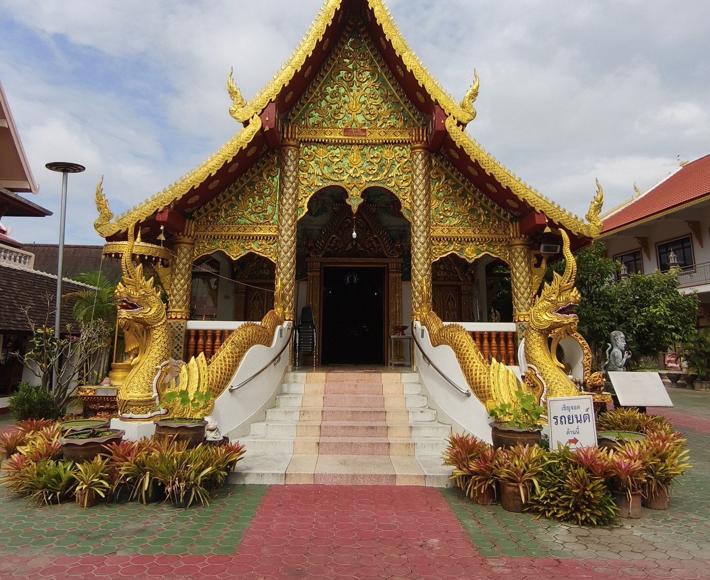 An ornate golden Lanna-style temple in Chiang Mai, where our team is based
