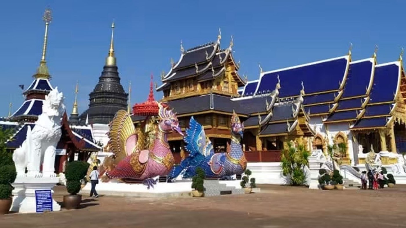An ornately decorated Northern Thai temple complex, the kind of setting where community festivals and temple fairs take place
