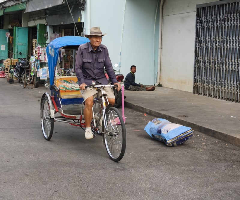 A peaceful pedicab ride through a quiet Chiang Mai neighborhood